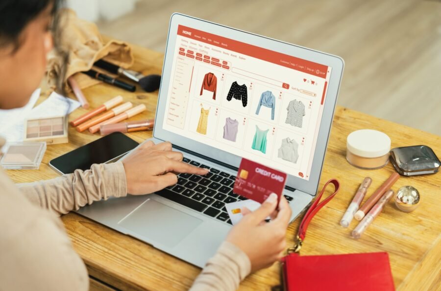 Woman shopping online on internet marketplace browsing for sale items for modern lifestyle and use credit card for online payment from wallet protected by crucial cyber security software